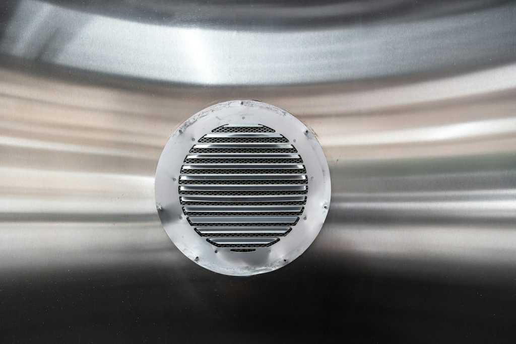 Close-up of a metal air conditioning vent grille